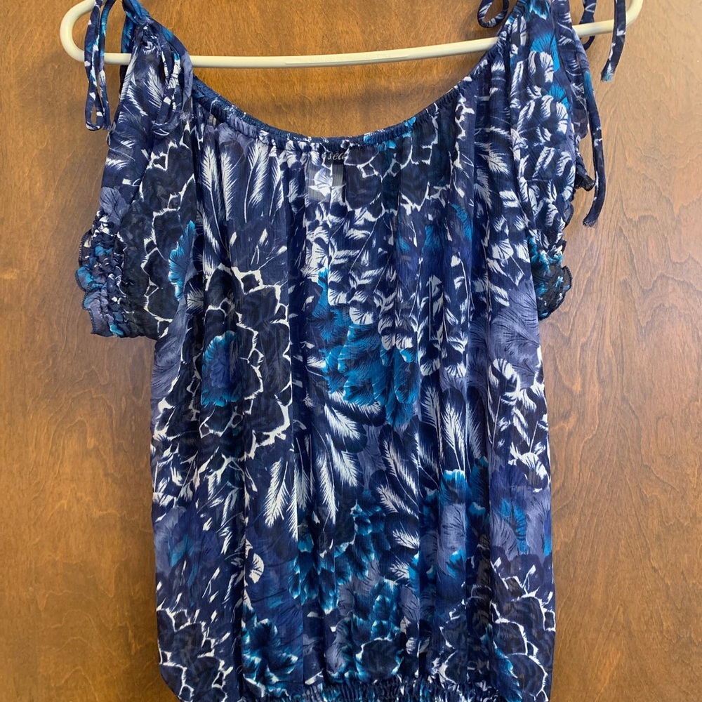 Sheer blouse with peek-a-boo shoulder